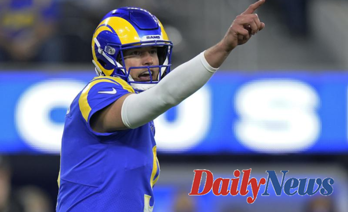 In a playoff rout, Stafford leads Rams past Cardinals 34-11