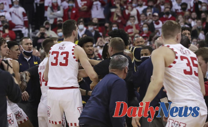 After a loss , Howard of Michigan hits out at the Wisconsin assistant