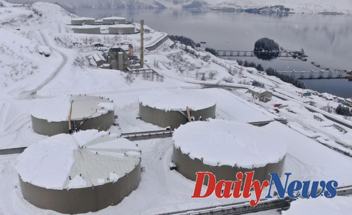 Crews clear snow from Alaska pipeline oil tanks damaged by storms