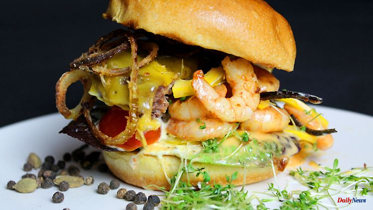 The woman at the grill: fish and meat combined in the surf and turf burger
