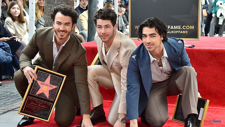 Honored on Walk of Fame: The Jonas Brothers unveil their star