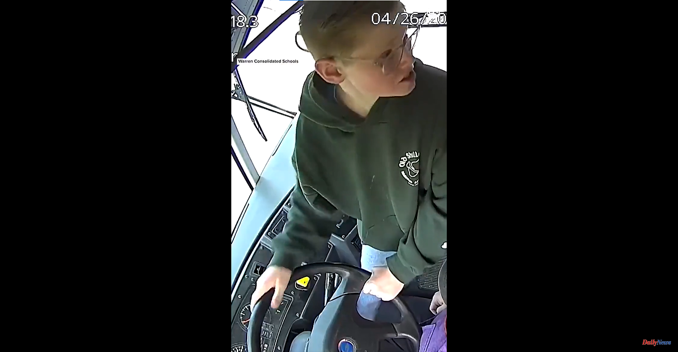 USA A 13-year-old boy brakes a school bus after the driver lost consciousness