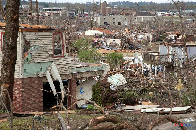 In the United States, a tornado in Arkansas and violent thunderstorms in Illinois kill at least four people