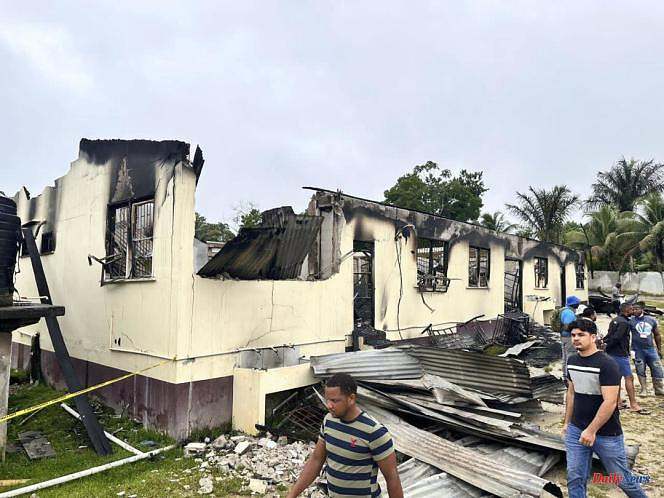 In Guyana, the deadly fire in a school dormitory was started following the confiscation of a laptop