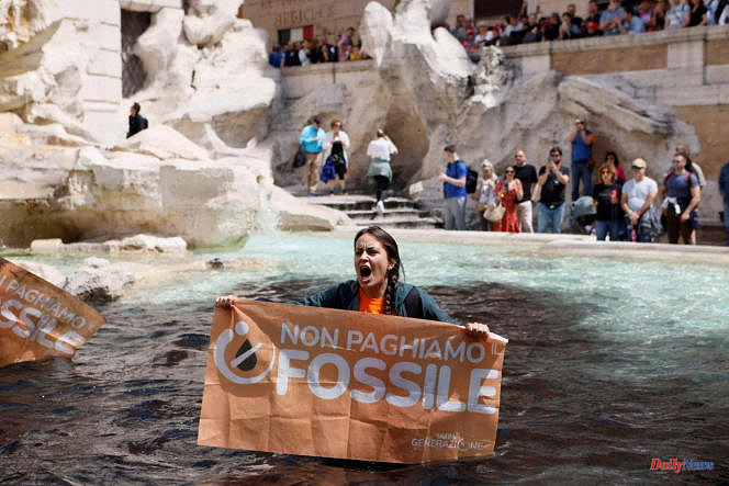 Trevi Fountain water colored black in Rome by environmental activists