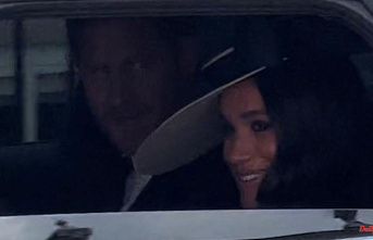 From the second row: Harry and Meghan remain in the background