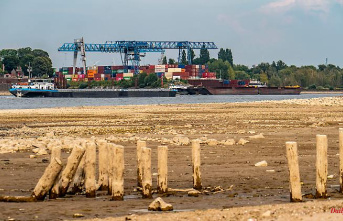 Low water impedes shipping: why is a river not dry when the water level is zero?