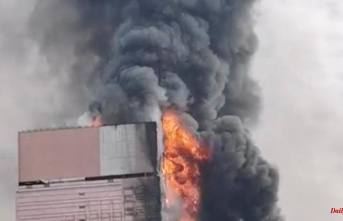 Videos with coal black building: China: Fire eats its way through high-rise