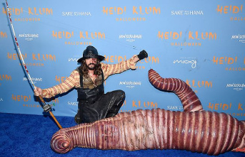 The worm on Tom's hook: Heidi presents fleshy Halloween costume