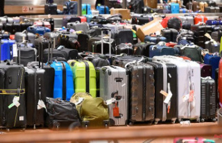 Symbol of flight chaos: mountains of suitcases stranded...