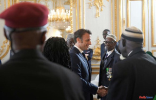 Emmanuel Macron receives at the Elysée nine former...