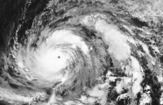 The island of Guam under the battering of Typhoon...