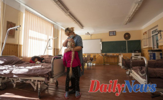 A girl and her pet hamster: Half the children of Ukraine flee war